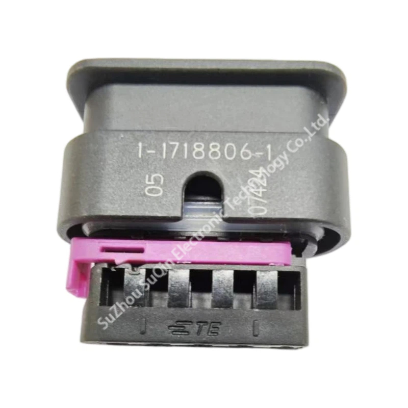Side profile view of the black automotive terminal carrier showing the crisp white laser-printed part number 1-1718806-1 and pink TPA slider.