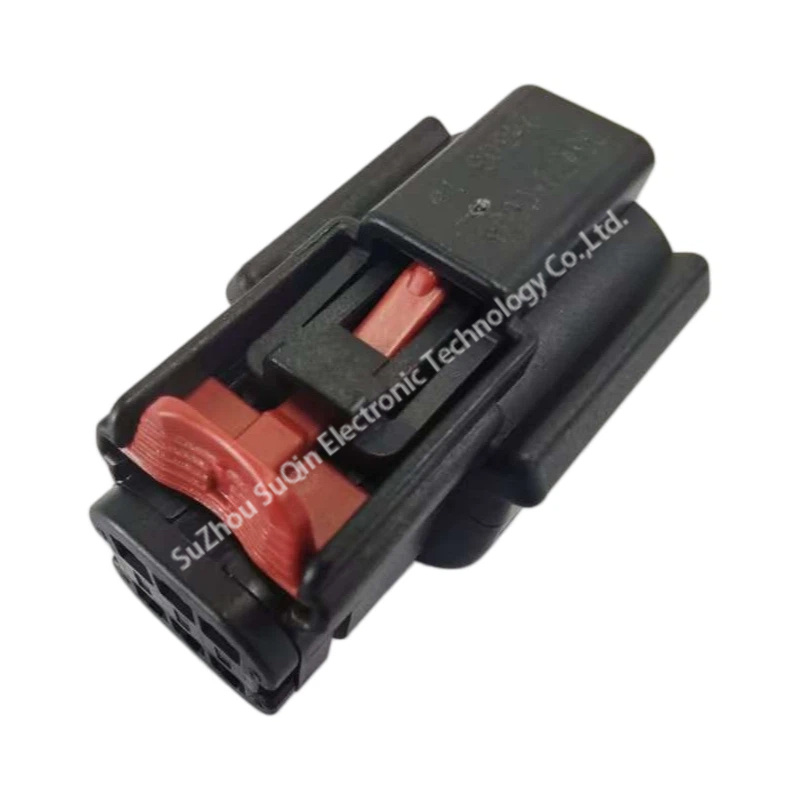 Perspective exterior view of the 33472-0606 housing highlighting the red Connector Position Assurance (CPA) locking latch on the top surface.
