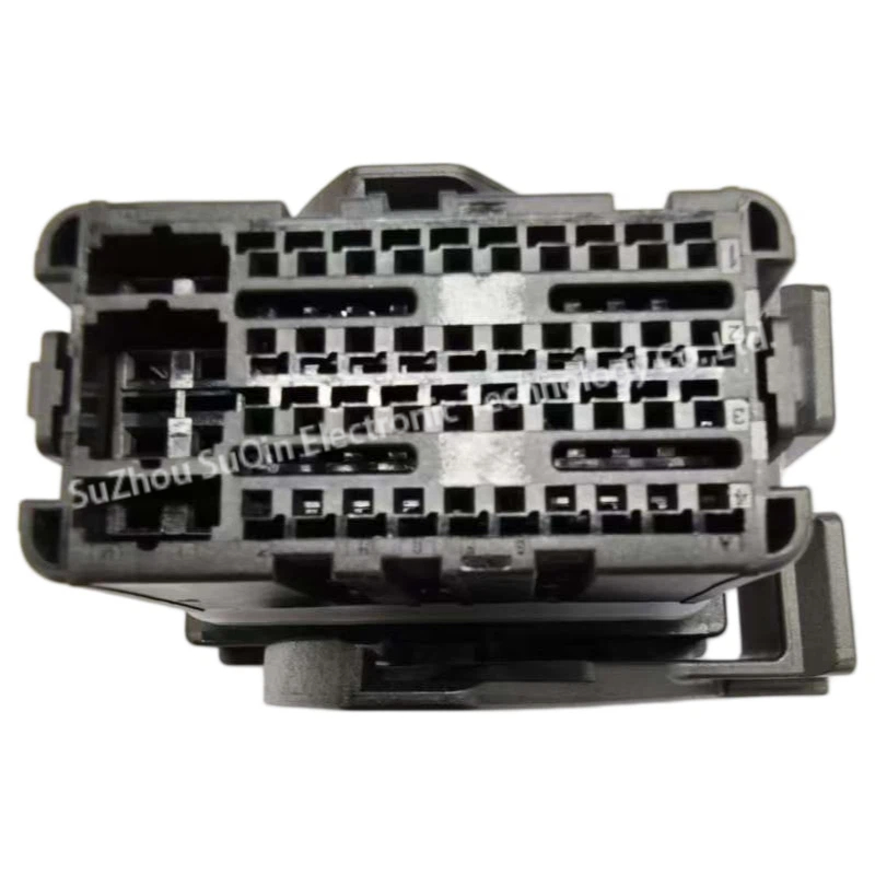 Rear wire-entry profile view of the 13956021 crimp housing highlighting the numbered terminal cavity rows and structured PBT guide tracks.