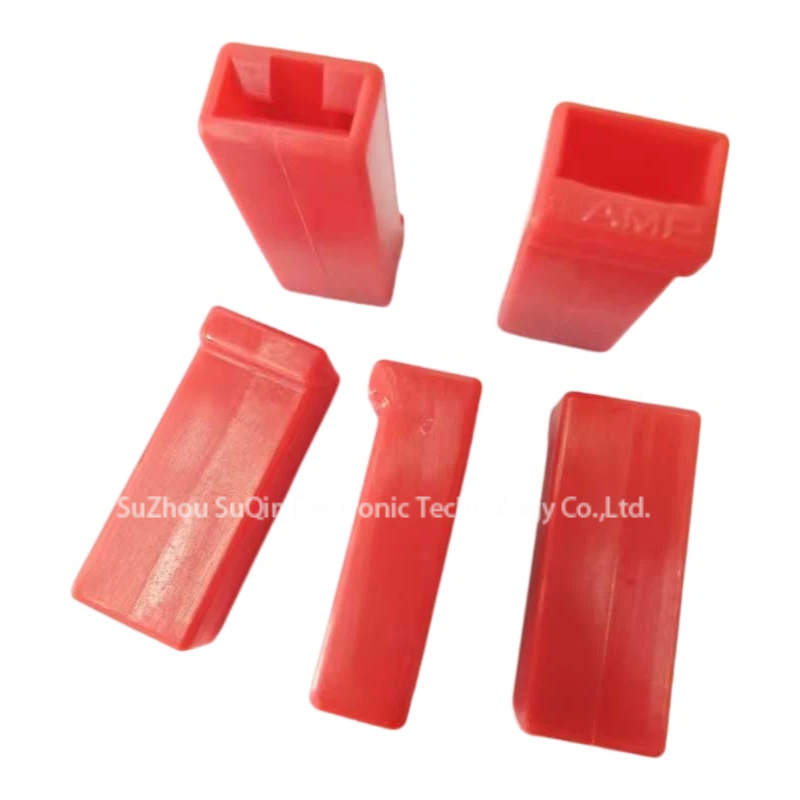 Multi-angle group display of five red 480054-5 FASTIN-FASTON receptacle terminal housings showing diverse architectural profiles and internal wire mating openings.