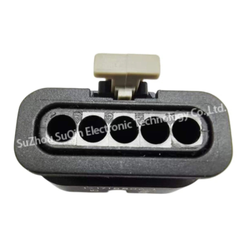 Direct front-facing view of the 5-position single-row female terminal mating interface of the 1-1718806-1 housing with a light grey locking latch on top.