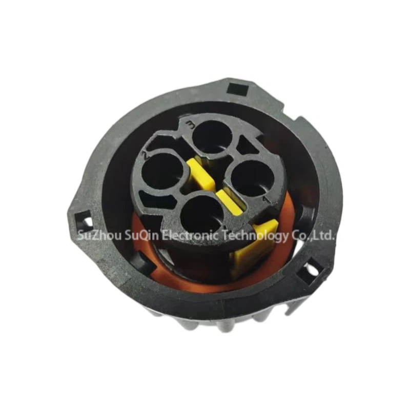 Close-up macro look inside the front collar of the 1-968968-1 female housing connector spotlighting the yellow terminal alignment block and integrated bright orange rubber seal.