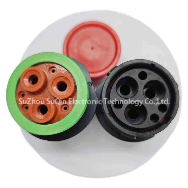 Side by side front and rear view comparison of Amphenol AHDP04-24-07PN-BRACL22 circular receptacle showing the green sealing band and black pin entry face with protective red caps.