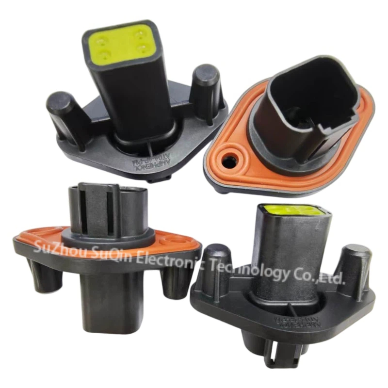 Four-piece multi-angle cluster view of Amphenol AT04-4P-PM12 4-pin black panel mount receptacles showing front shroud with orange flange gasket seal and green rear wire end.