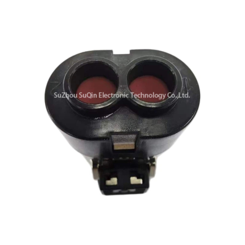 Rear view of the PL182Y-61-4 connector housing displaying two circular wire entry ports labeled 1 and 2 with internal red silicone sealing grommets.