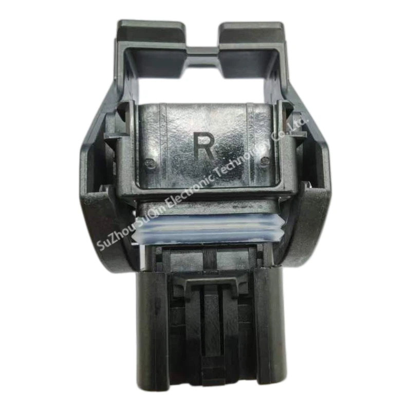 Top profile view of the 13956021 automotive receptacle housing showing the molded letter R marking and the ribbed silicone weather seal track.