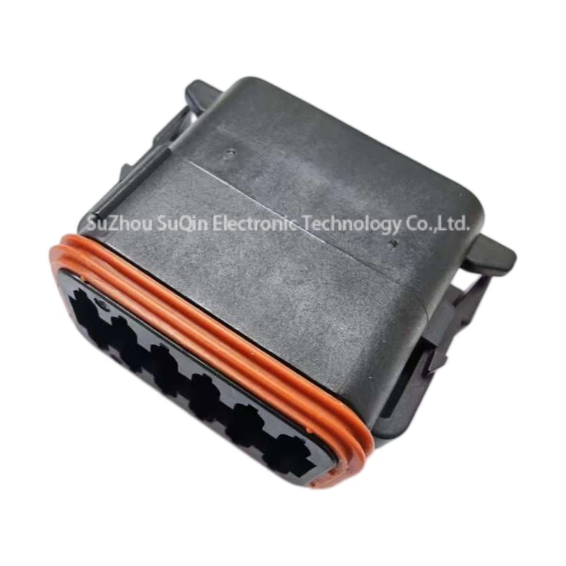 Side view profile of the black DT06-12SB connector housing featuring the integrated locking clip and double-ribbed orange mating seal.