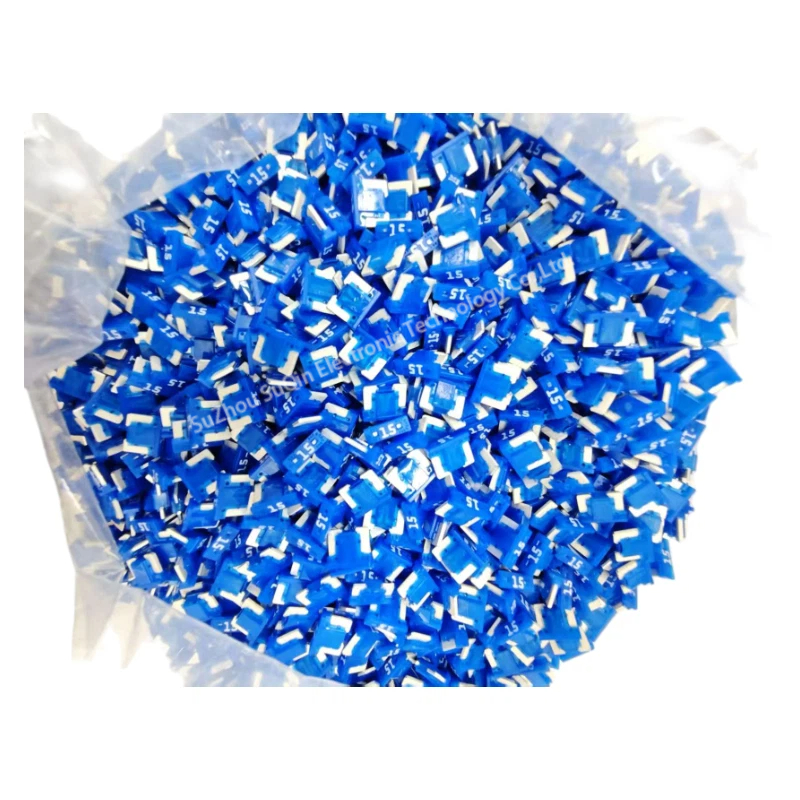 Industrial bulk packaging of Littelfuse 0891015.NXS 15A fuses for mass production.