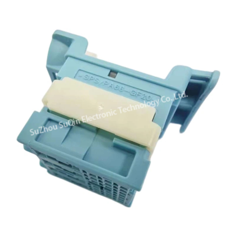 Bottom isometric view of a single blue Molex 1600290013 connector housing showing the integrated white lock clip and molded material text designation.