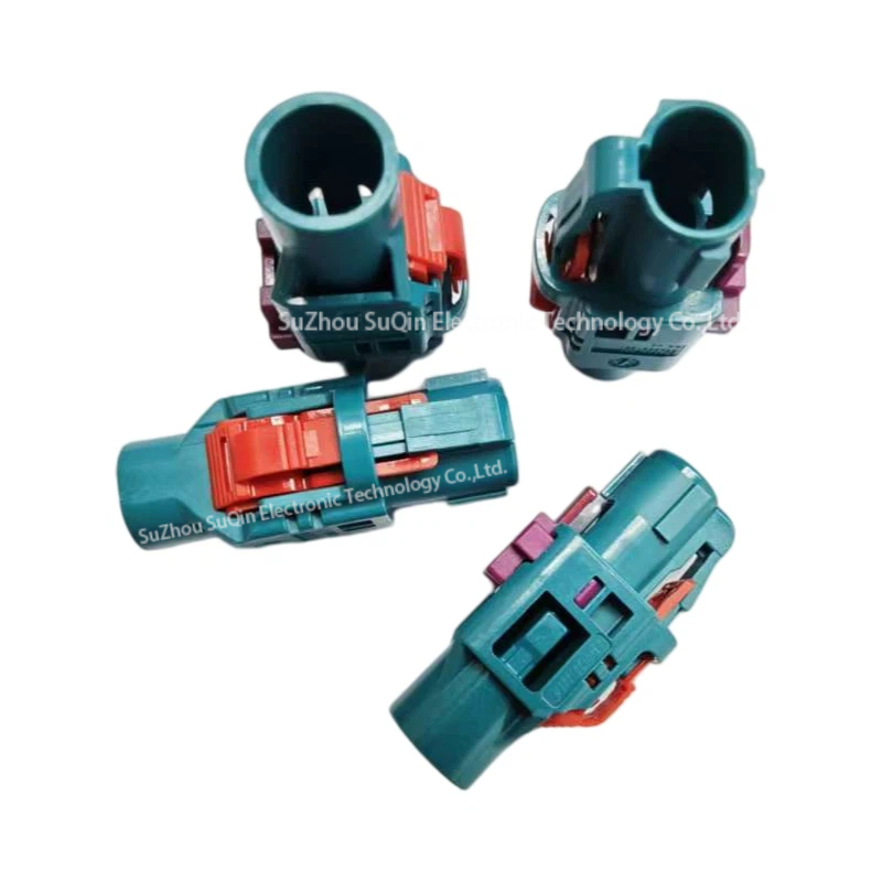 Multi-angle group view of four water blue Rosenberger E6Z020-000-Z H-MTD plug housings showing entry ports and red locking mechanisms.