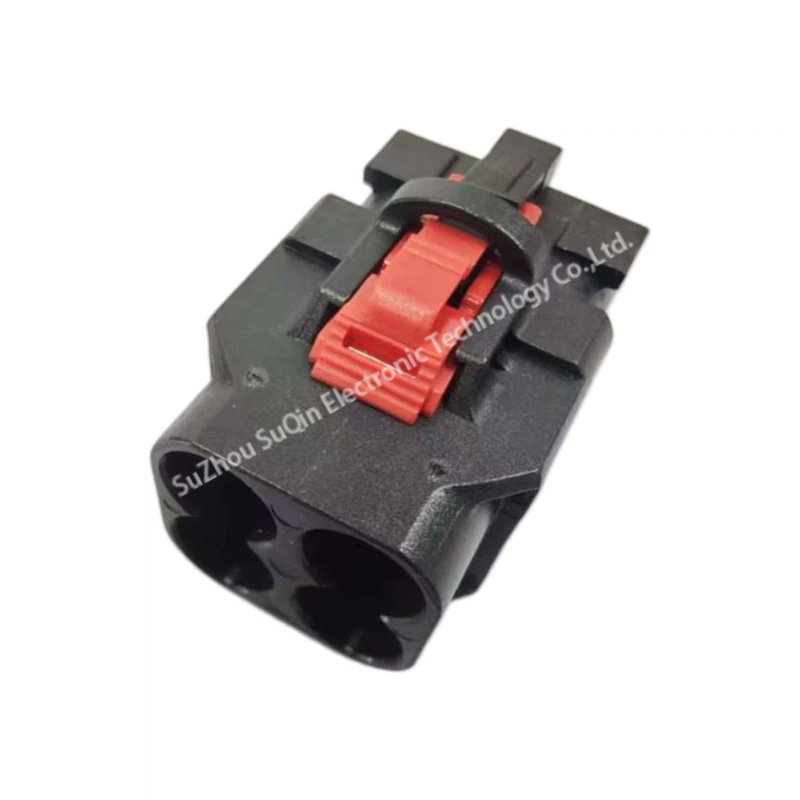 Isometric top-front view of a single black E6Z027-001-A H-MTD plastic housing focusing on the top-mounted red CPA clip and primary locking latch.