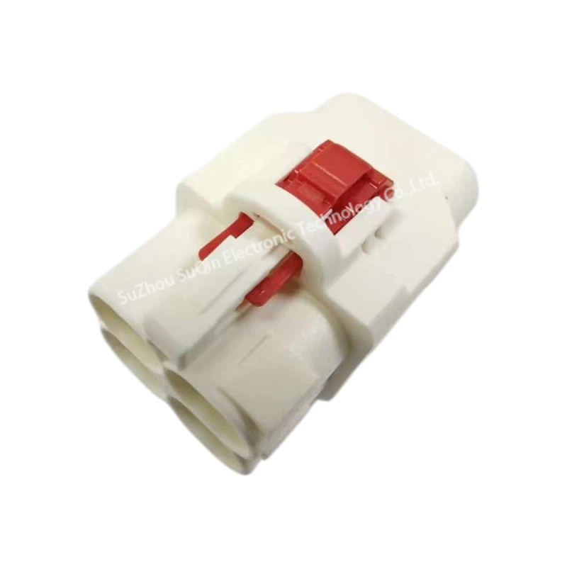 Isometric top-front view of a single white E6Z027-001-B H-MTD plastic housing focusing on the top-mounted red CPA clip and primary locking latch.