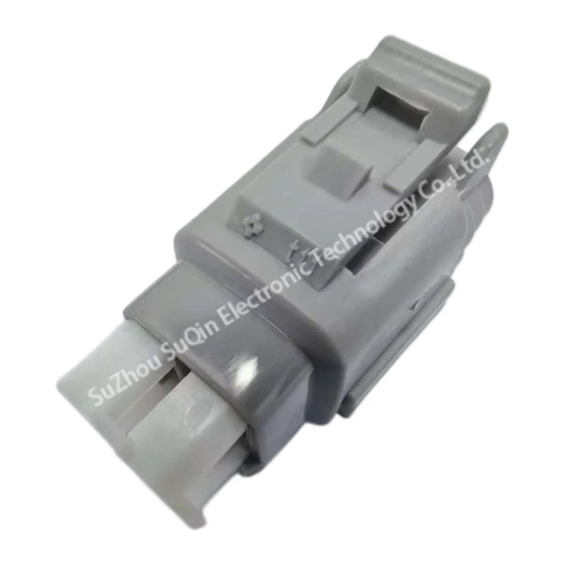 Isometric top-front view of a single gray 6189-0372 automotive housing focusing on the top integrated locking lever and clean molded shell texture.