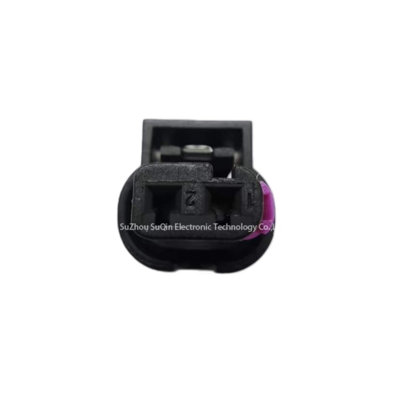 Rear wire exit face view focusing on the 2-position single-row terminal configuration with molded circuit cavity identifier numbers 1 and 2, along with the adjacent purple component clip.