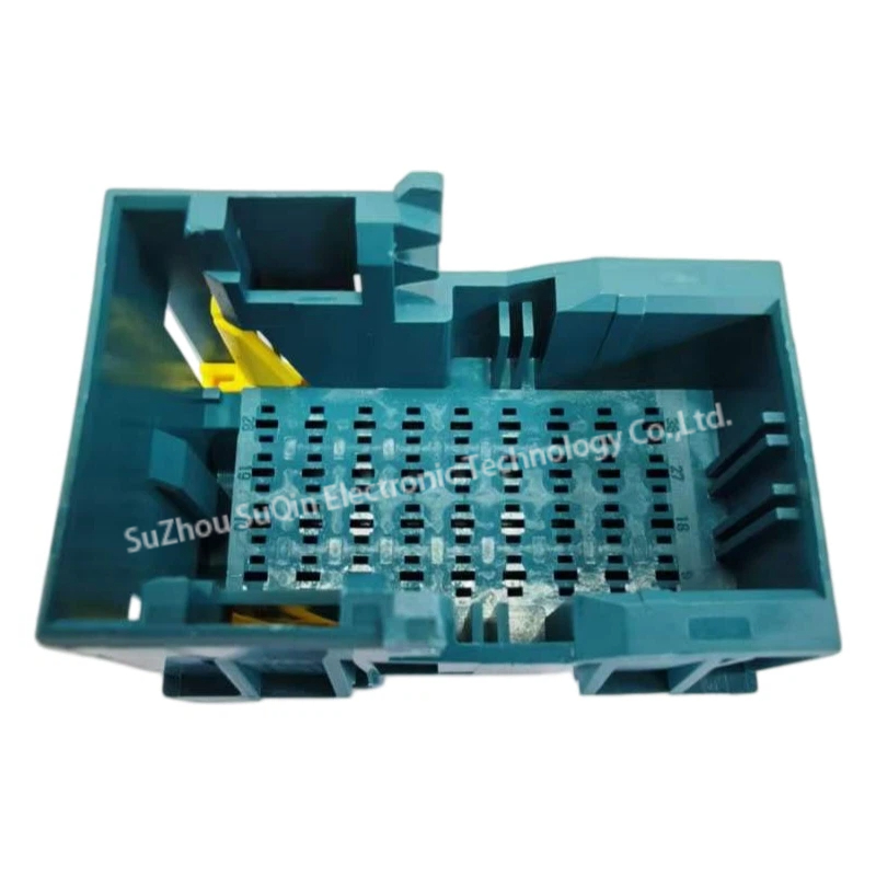 Front-on internal view looking directly into the open mating cavity of the blue 1-2112891-4 housing, showing the terminal guide tracks and the internal yellow alignment spacer.
