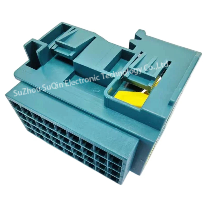Isometric view of the blue rectangular 1-2112891-4 male terminal housing, showing the exterior interlocking channels and the integrated yellow locking clip slider.