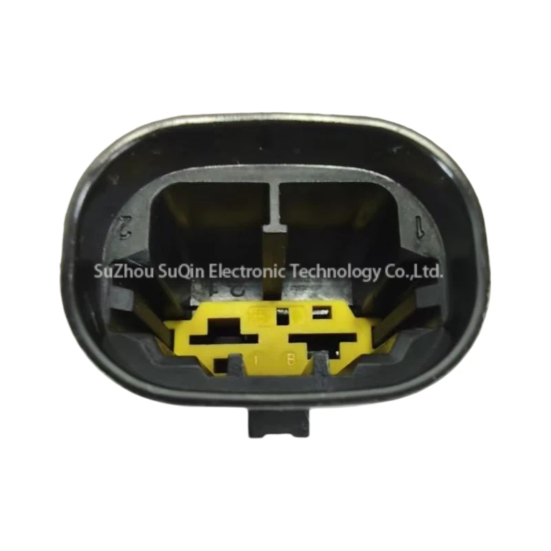 Front mating interface view looking directly into the shroud cavity, highlighting the bright yellow internal TPA locking grid and molded circuit numbers 1 and 2.