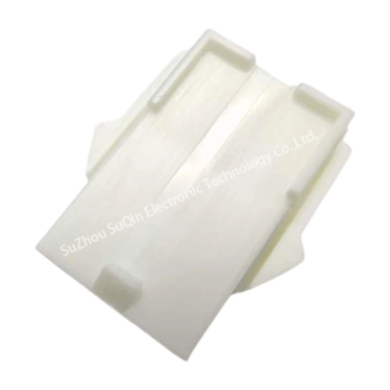 Macro top view of a natural nylon rectangular cap housing highlighting the smooth side rail profile and panel retention geometry.