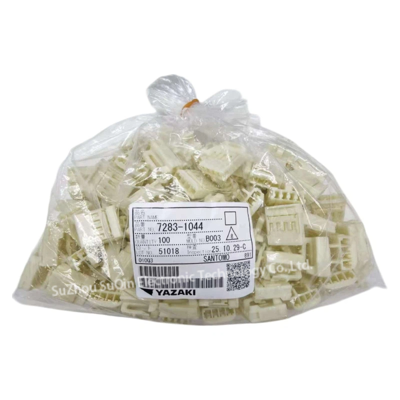 Industrial factory packaging presentation showing a sealed clear plastic bag filled with 100 units of the matching 7283-1044 female housings, featuring an official Yazaki tracking barcode label.